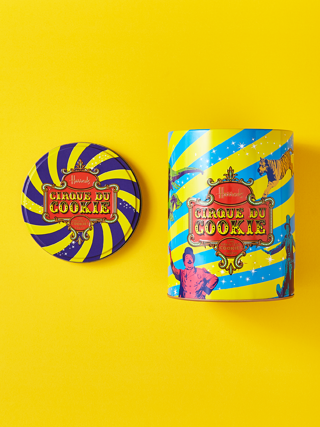 Metal cookie packaging on a yellow background.