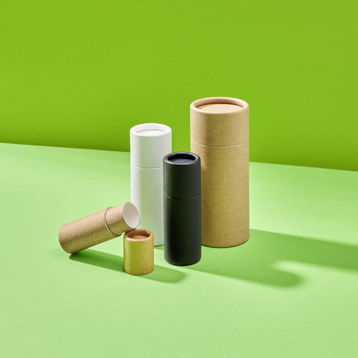 Collection of push-up base deodorant tubes in three colours. 